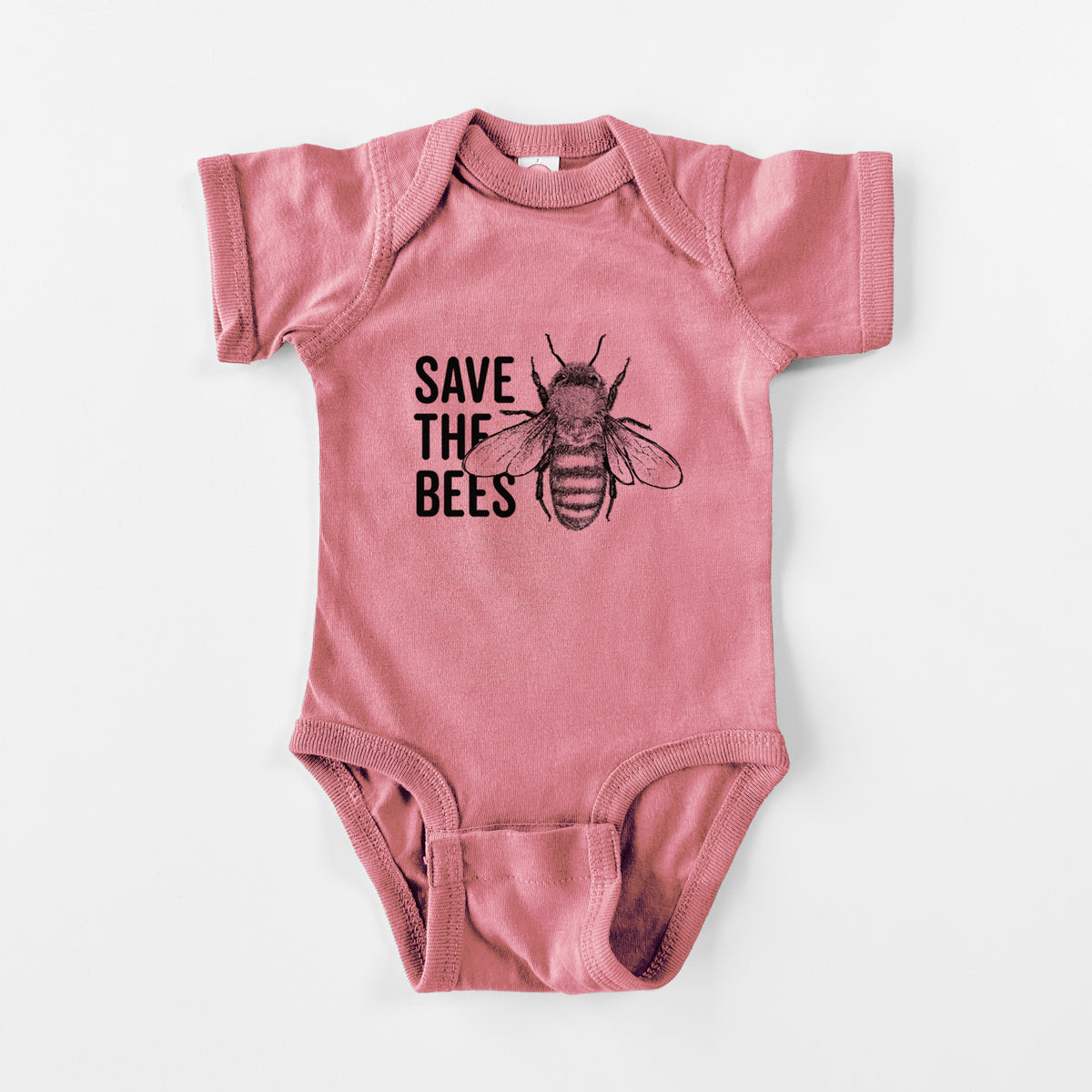 Mauve pink baby bodysuit laid flat, printed with bold black words reading Save the Bees beside a detailed honey bee illustration.