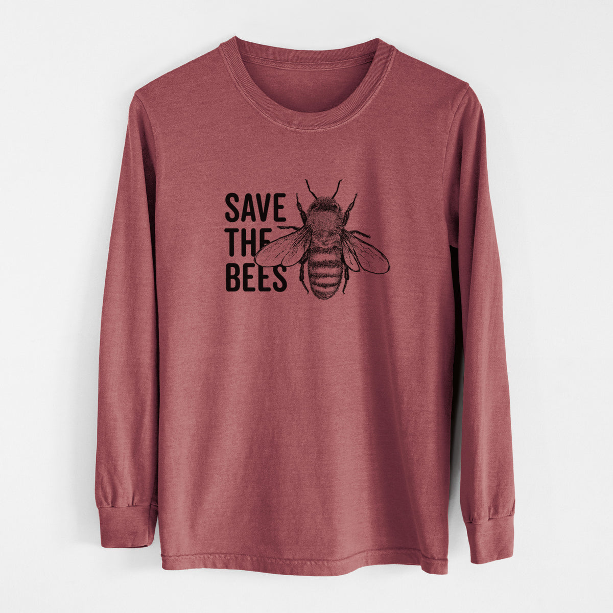 Brick red Comfort Colors long sleeve shirt laid flat, printed with bold black words reading Save the Bees beside a detailed honey bee illustration.