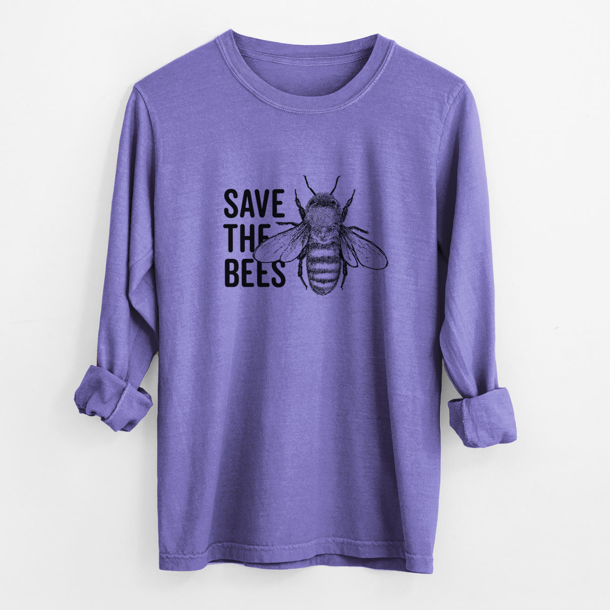Violet purple Comfort Colors long sleeve shirt laid flat with the cuffs rolled, printed with bold black words reading Save the Bees beside a detailed honey bee illustration.