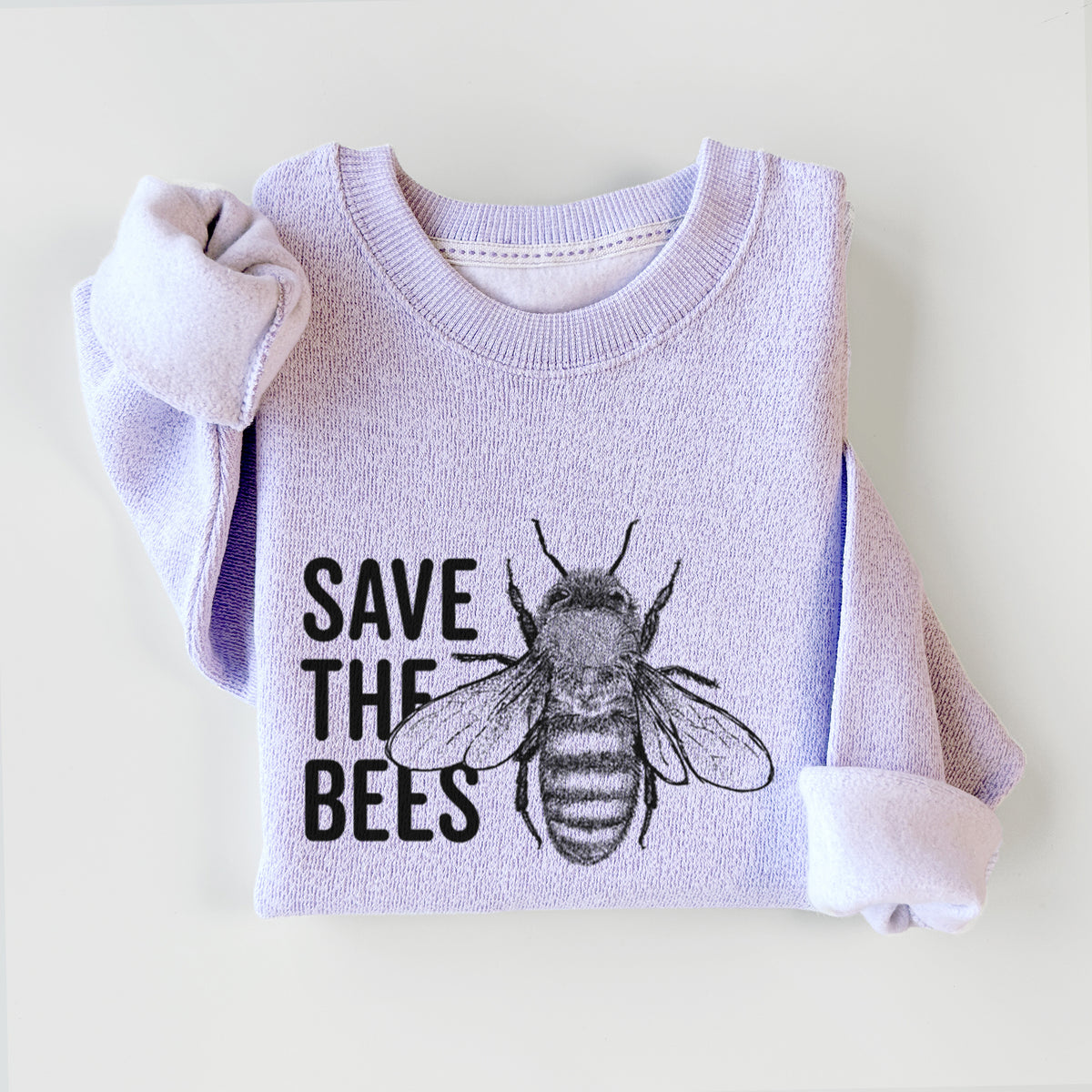 Ice purple knit sweatshirt printed with bold black words reading Save the Bees beside a detailed honey bee illustration, styled flat.