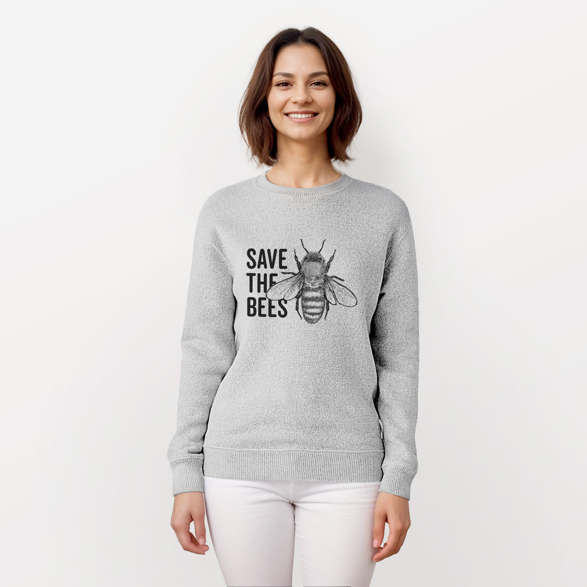 Woman wearing a knit sweatshirt printed with bold black words reading Save the Bees beside a detailed honey bee illustration.