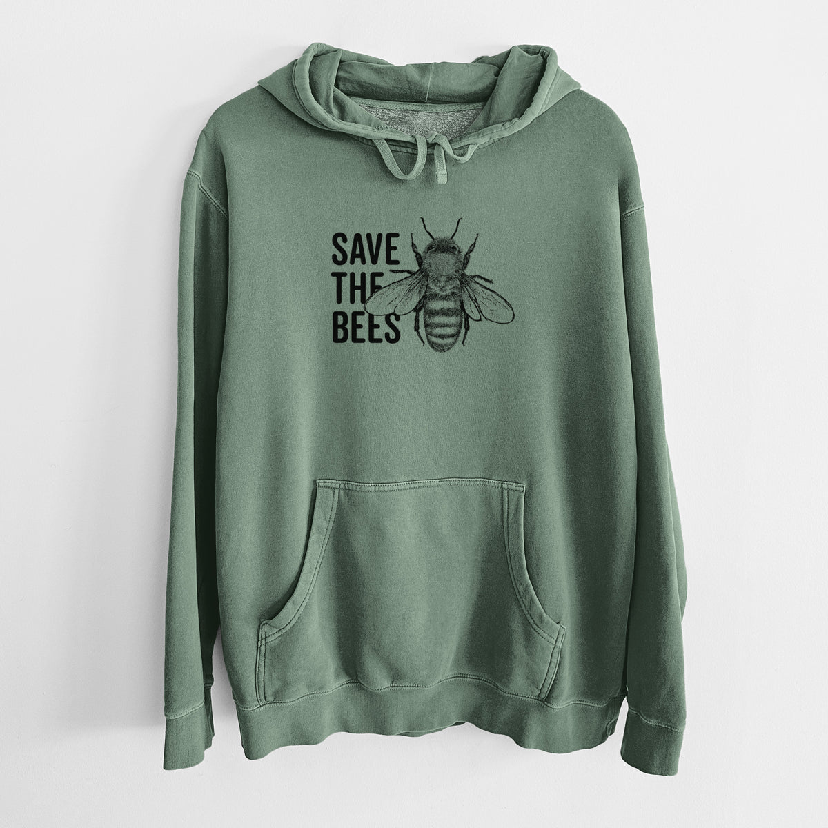 Alpine green pigment dyed hoodie laid flat, printed with bold black words reading Save the Bees beside a detailed honey bee illustration.