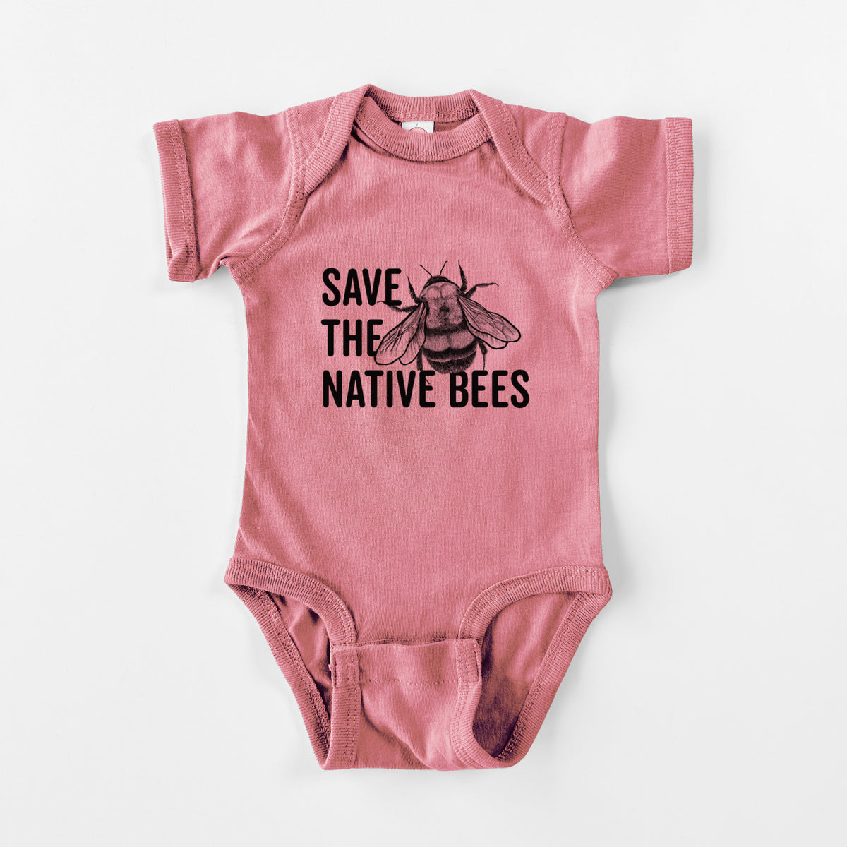 Mauve pink baby bodysuit laid flat, printed with bold black words reading Save the Native Bees beside a detailed bee illustration.