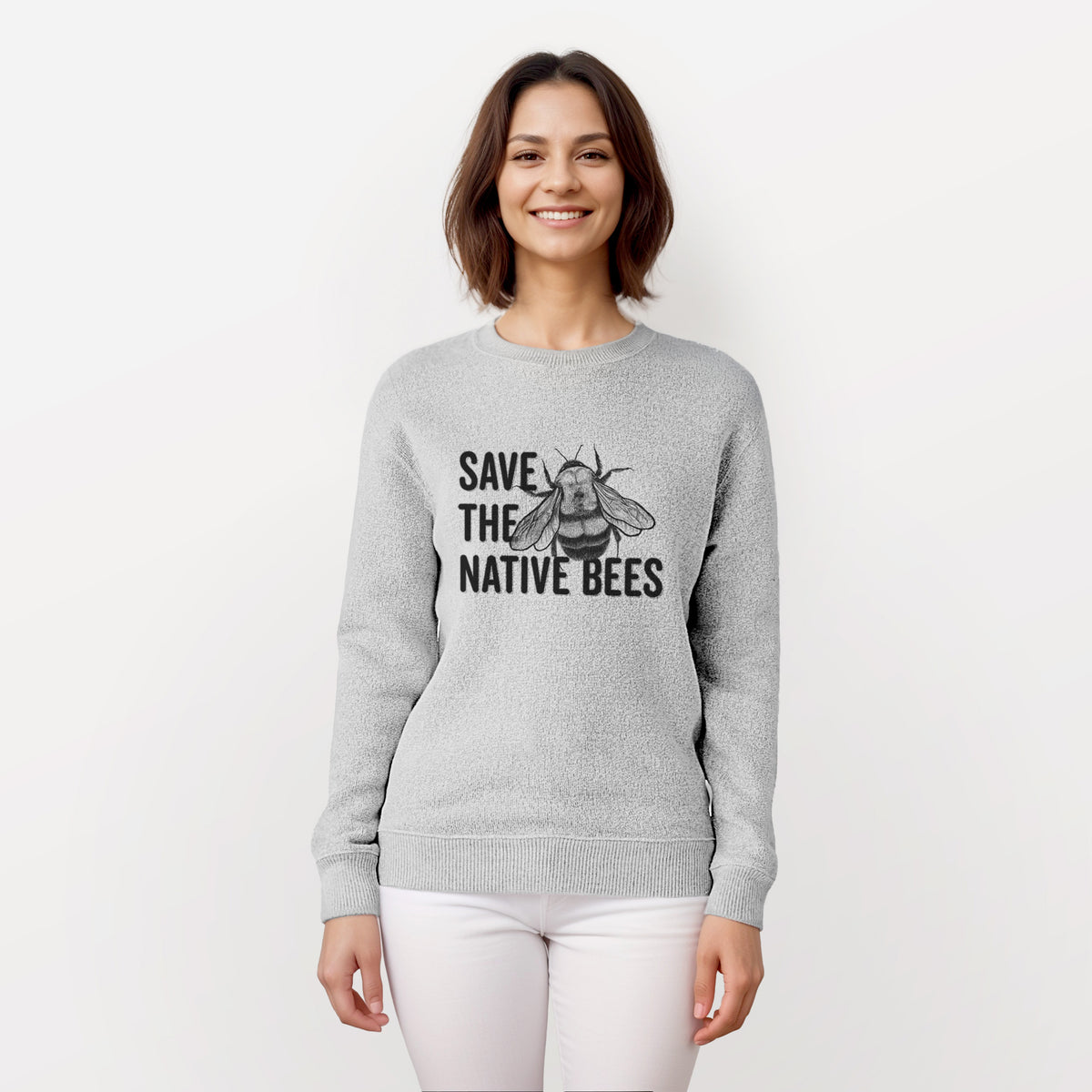 Woman wearing a knit sweatshirt printed with bold black words reading Save the Native Bees beside a detailed bee illustration.