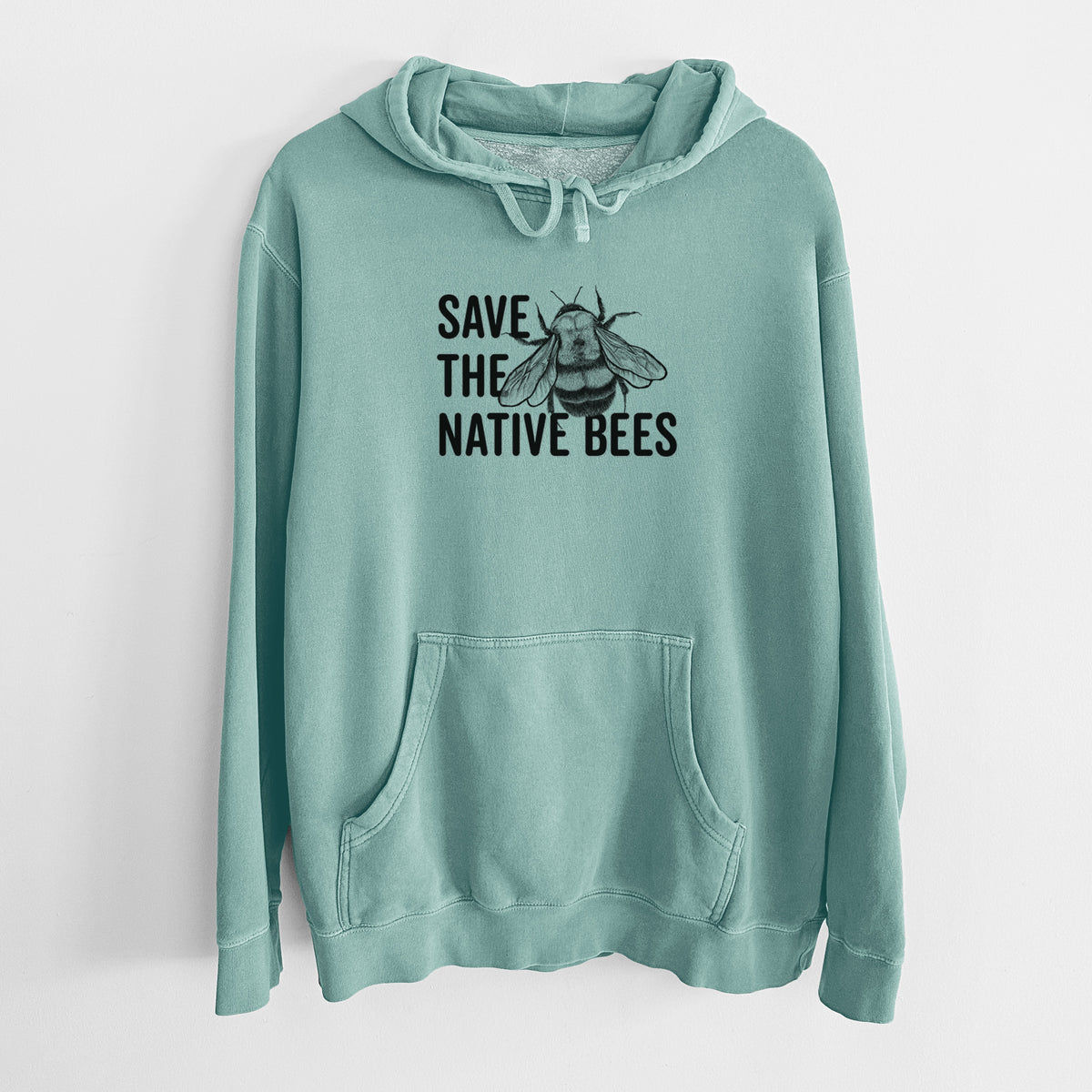 Mint green pigment dyed hoodie laid flat, printed with bold black words reading Save the Native Bees beside a detailed bee illustration.