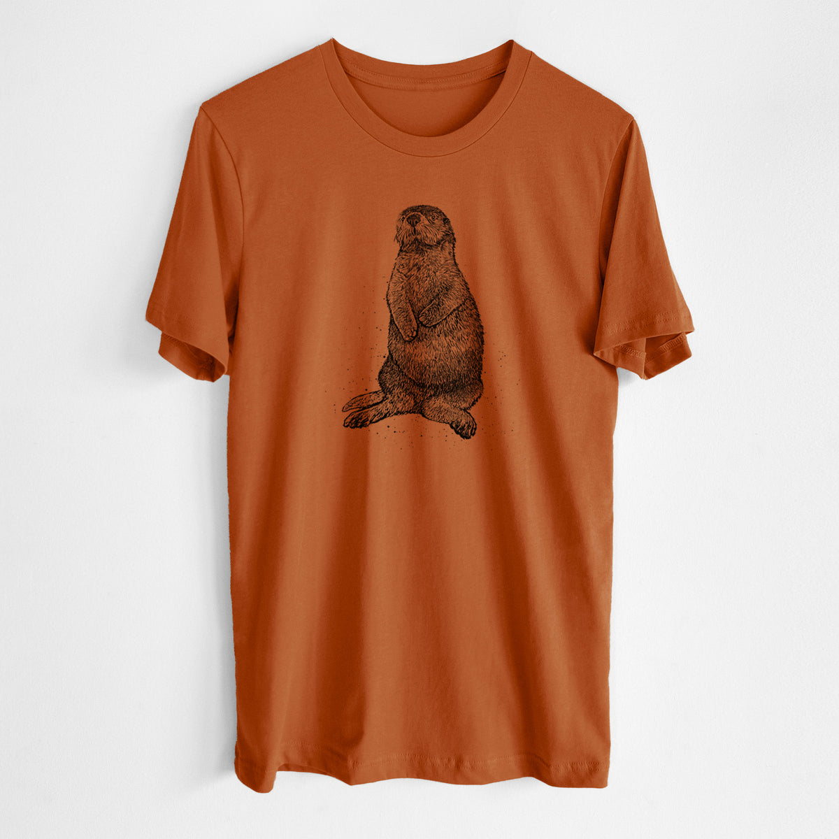 Autumn lightweight cotton t-shirt laid flat, printed with a detailed black ink illustration of a sea otter sitting upright.