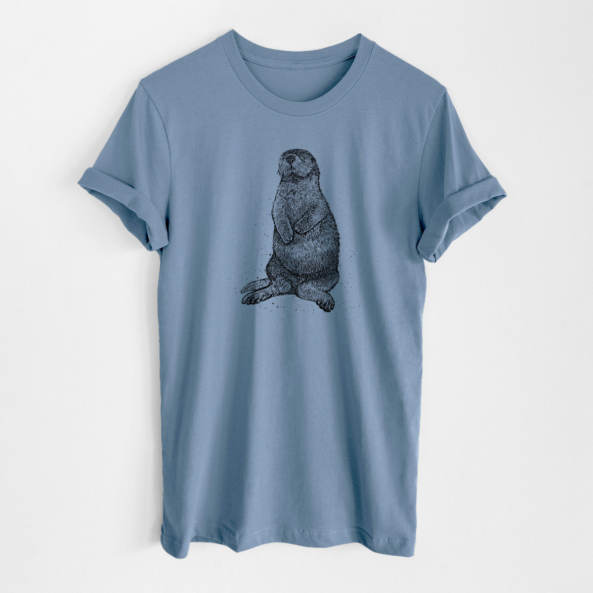 Steel blue lightweight cotton t-shirt laid flat, printed with a detailed black ink illustration of a sea otter sitting upright.