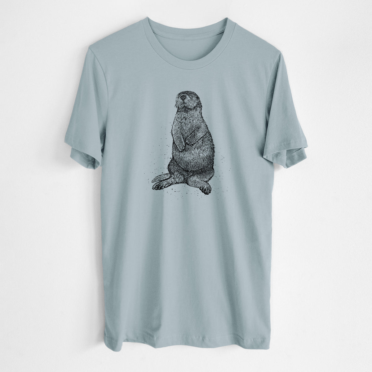 Vintage denim lightweight cotton t-shirt laid flat, printed with a detailed black ink illustration of a sea otter sitting upright.