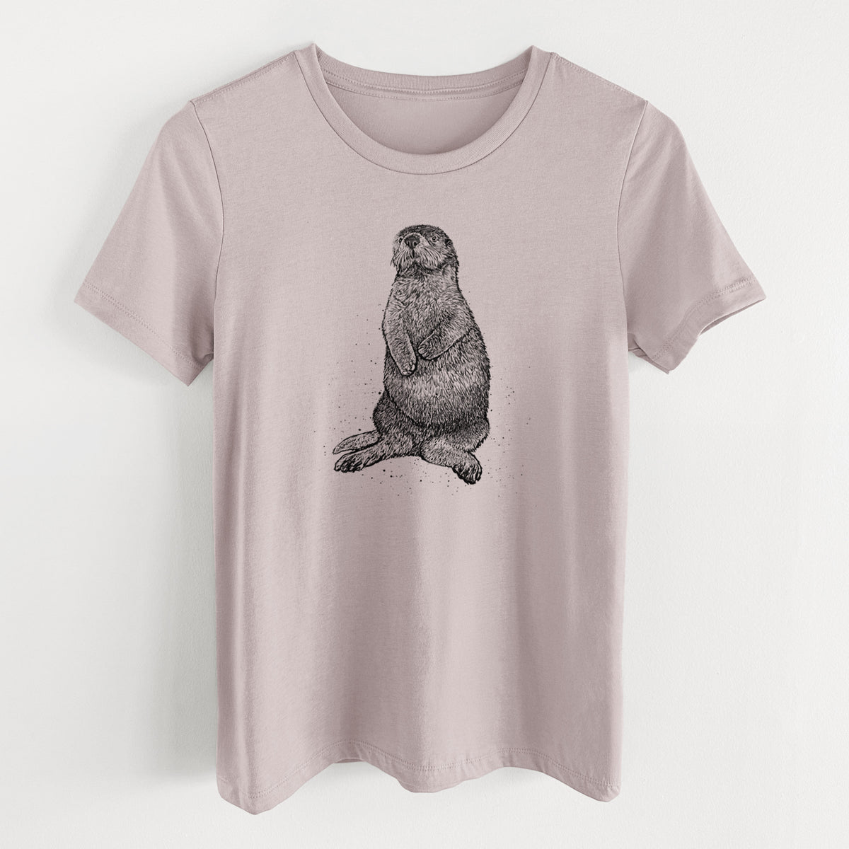 Pink gravel women's relaxed fit cotton t-shirt laid flat, printed with a detailed black ink illustration of a sea otter sitting upright.