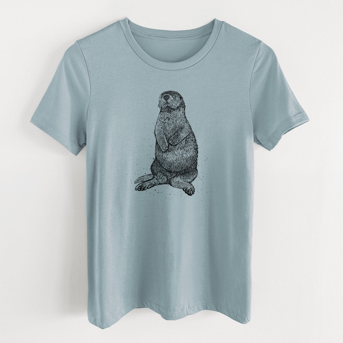 Vintage denim women's relaxed fit cotton t-shirt laid flat, printed with a detailed black ink illustration of a sea otter sitting upright.