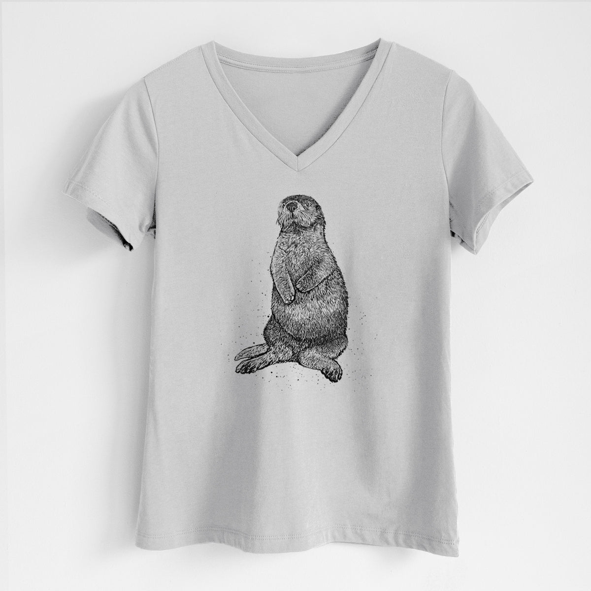 Lunar grey women's relaxed fit cotton V-neck t-shirt laid flat, printed with a detailed black ink illustration of a sea otter sitting upright.