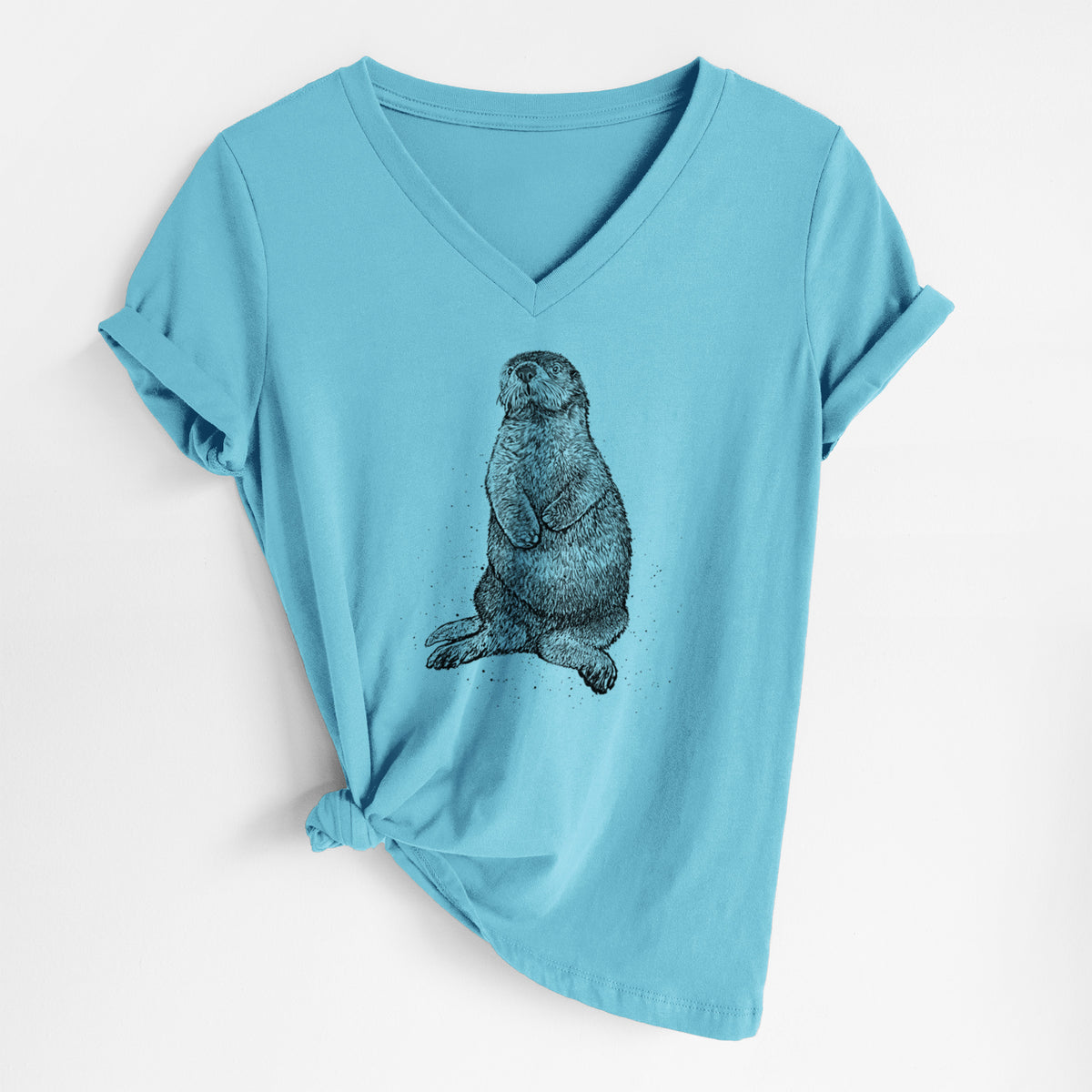 Turquoise women's relaxed fit cotton V-neck t-shirt laid flat, printed with a detailed black ink illustration of a sea otter sitting upright.
