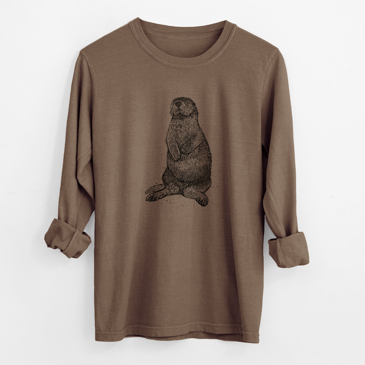 Espresso brown Comfort Colors long sleeve shirt laid flat with the cuffs rolled, printed with a detailed black ink illustration of a sea otter sitting upright.