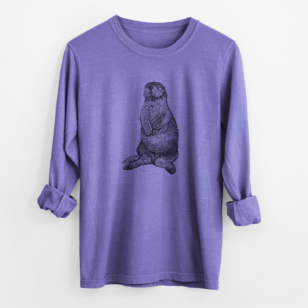 Violet purple Comfort Colors long sleeve shirt laid flat with the cuffs rolled, printed with a detailed black ink illustration of a sea otter sitting upright.