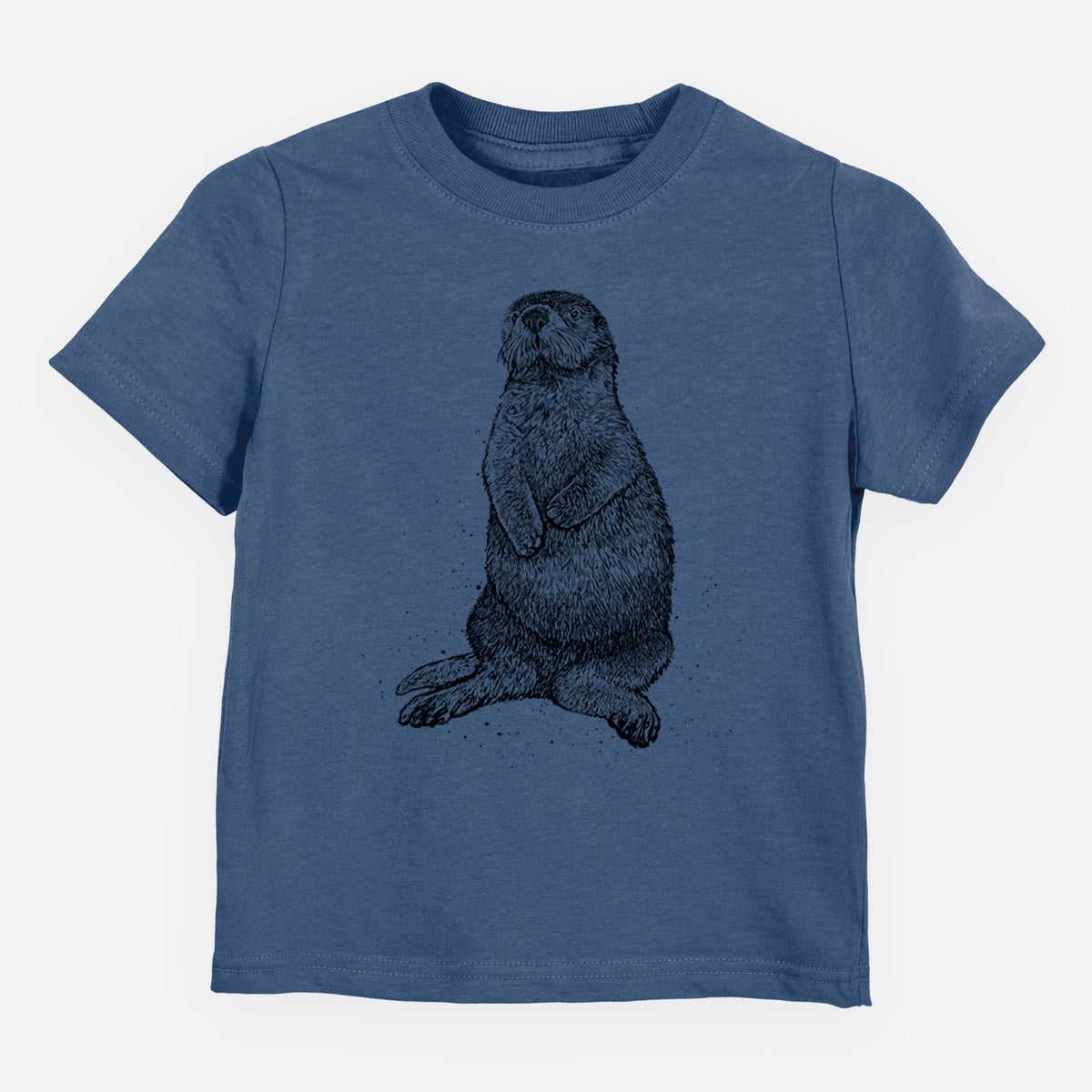 Indigo blue toddler t-shirt laid flat, printed with a detailed black ink illustration of a sea otter sitting upright.