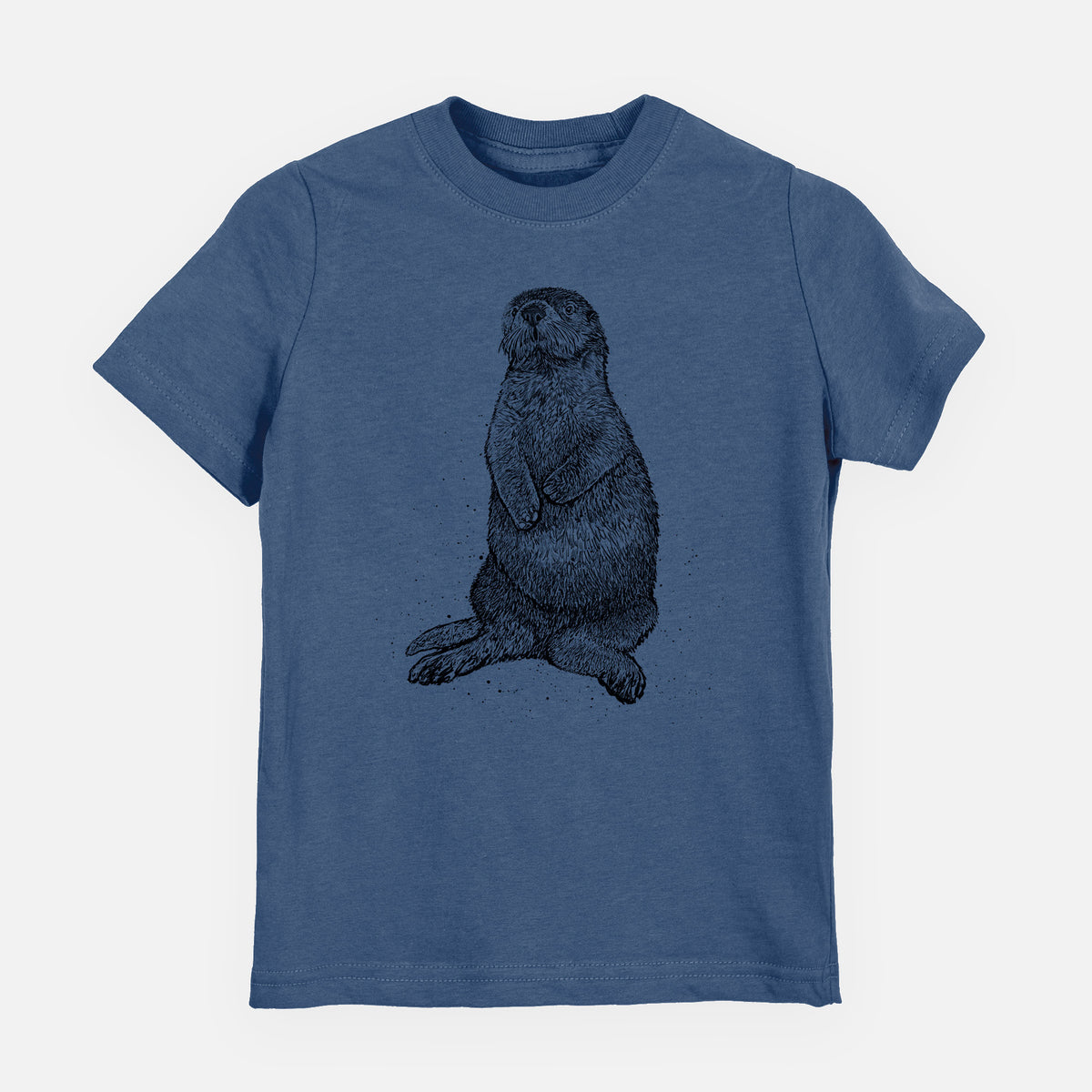 Indigo blue youth t-shirt laid flat, printed with a detailed black ink illustration of a sea otter sitting upright.