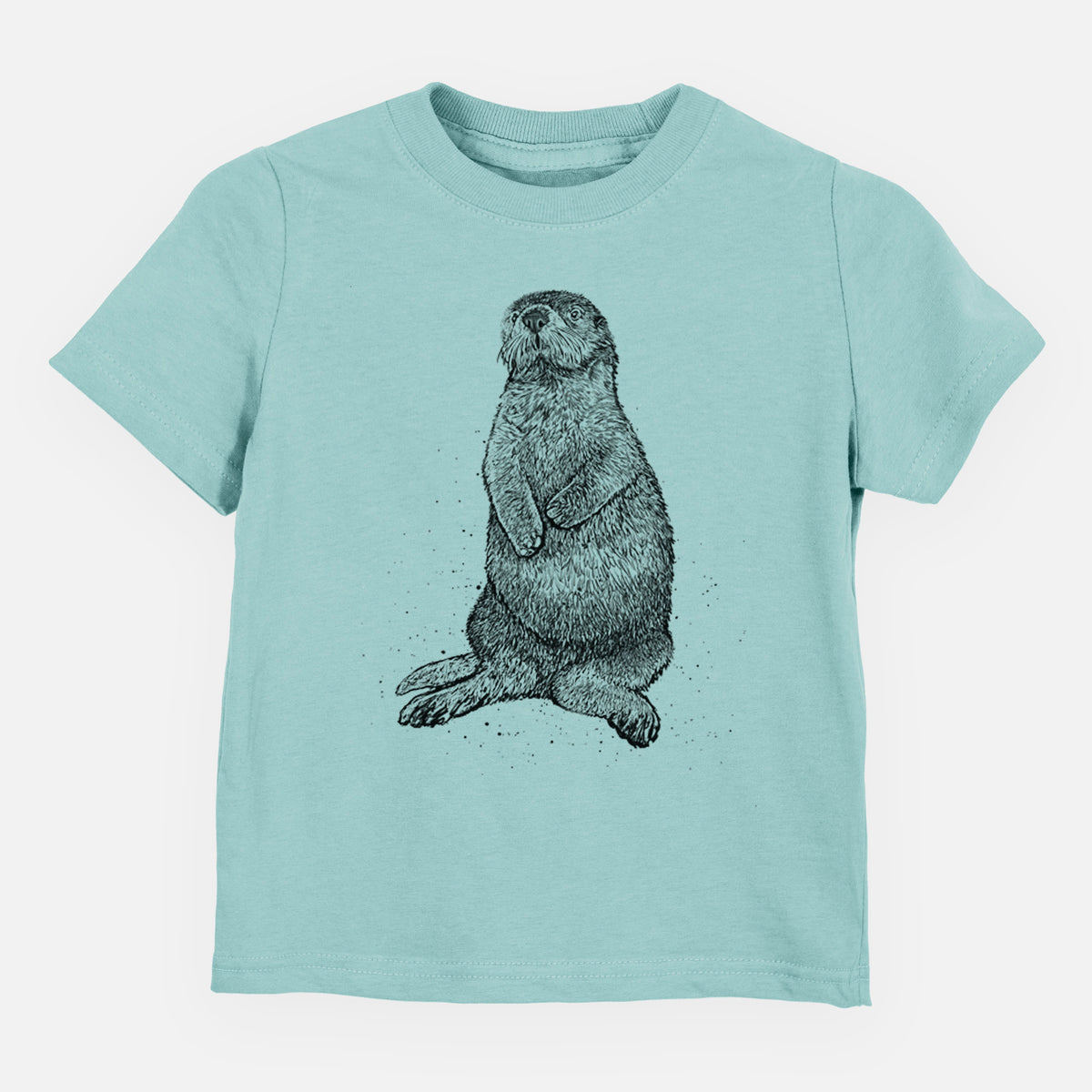Saltwater toddler t-shirt laid flat, printed with a detailed black ink illustration of a sea otter sitting upright.