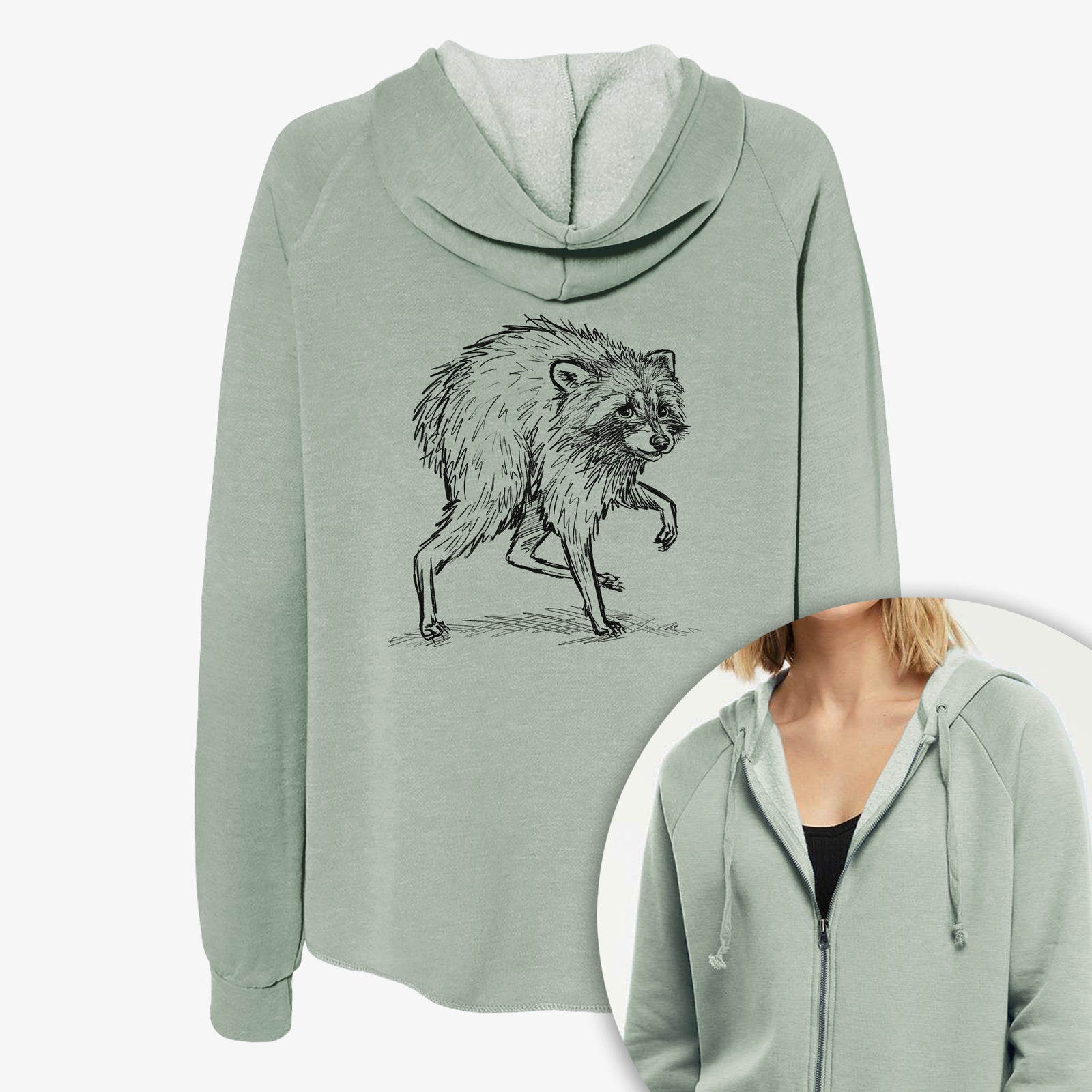 Women's Cali Wave zip-up sweatshirt printed with a detailed black ink illustration of a scruffy raccoon walking, with a close-up of the zipper.
