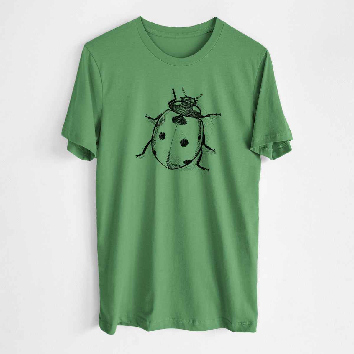 Leaf green lightweight cotton t-shirt laid flat, printed with a detailed black ink illustration of a seven-spot ladybird beetle.
