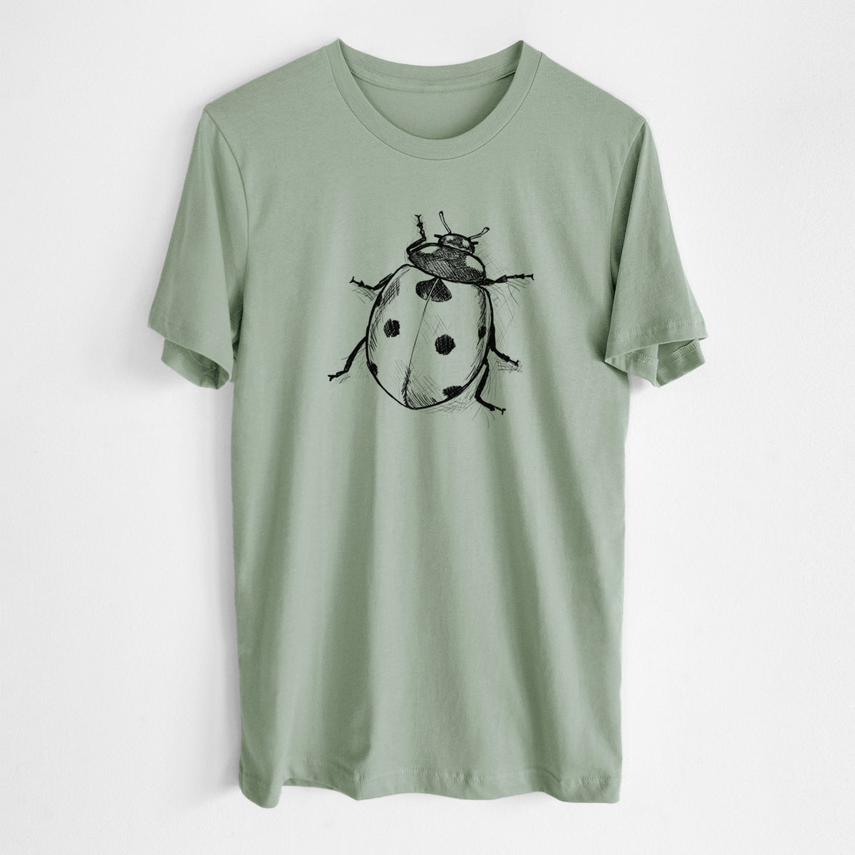 Sage green lightweight cotton t-shirt laid flat, printed with a detailed black ink illustration of a seven-spot ladybird beetle.