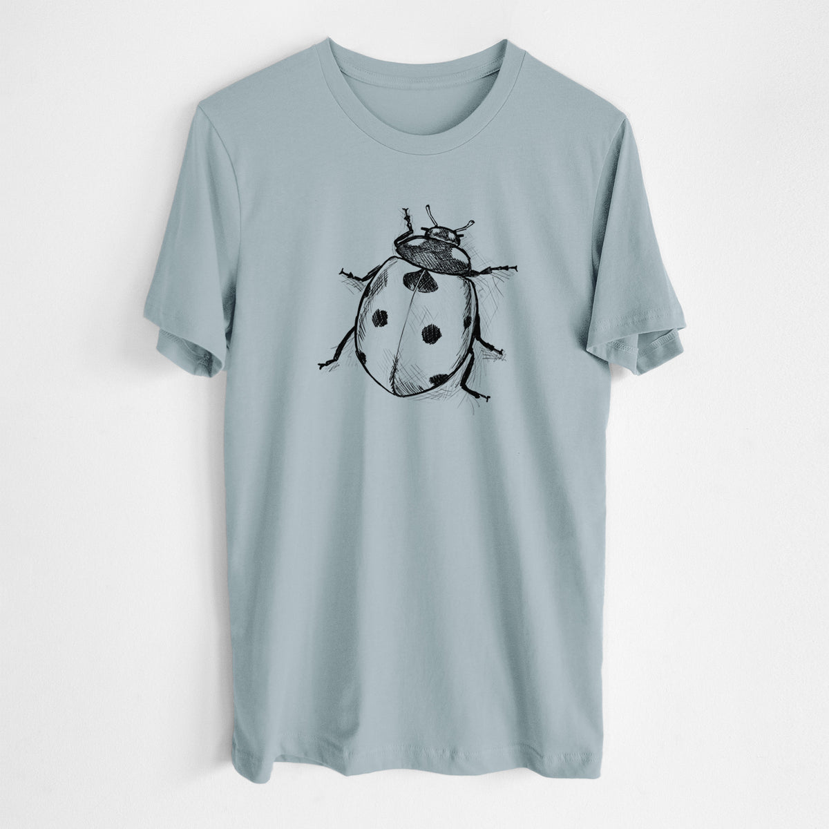 Vintage denim lightweight cotton t-shirt laid flat, printed with a detailed black ink illustration of a seven-spot ladybird beetle.
