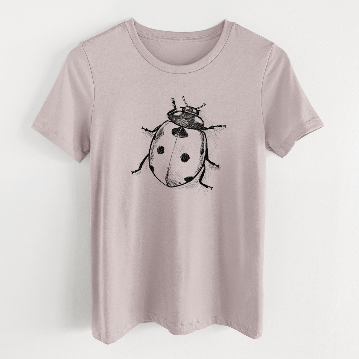 Pink gravel women's relaxed fit cotton t-shirt laid flat, printed with a detailed black ink illustration of a seven-spot ladybird beetle.