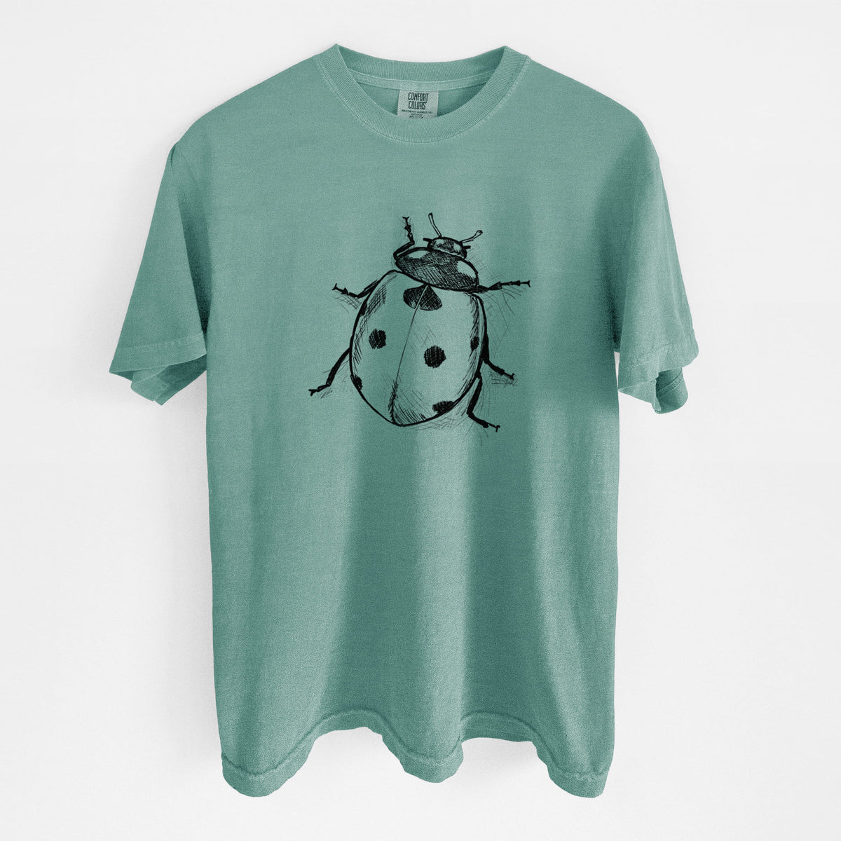 Reef green Comfort Colors t-shirt laid flat, printed with a detailed black ink illustration of a seven-spot ladybird beetle.