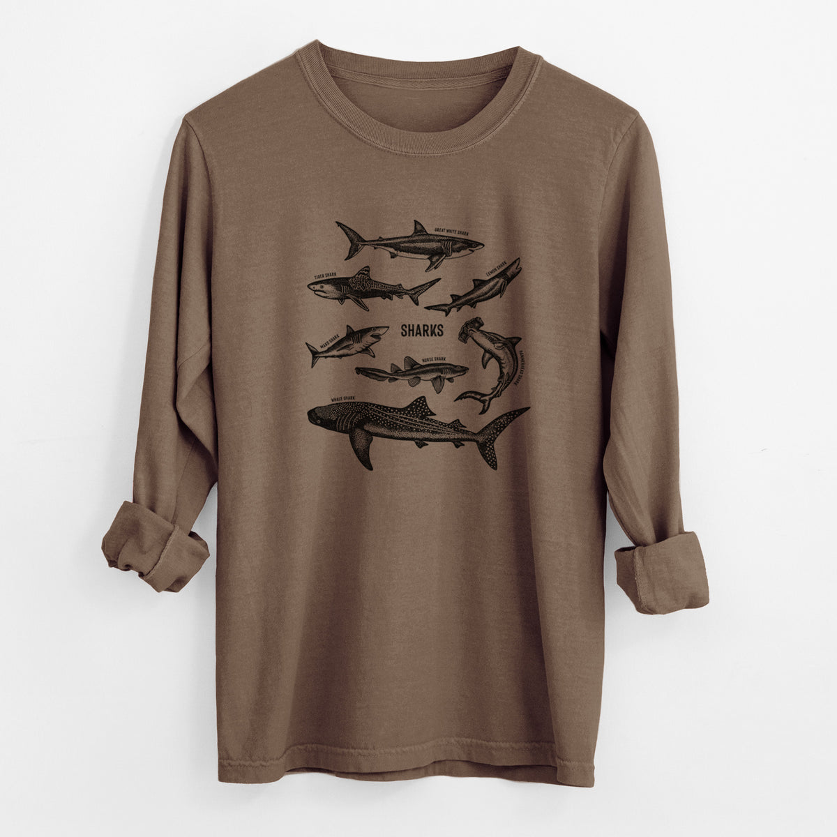 Espresso brown Comfort Colors long sleeve shirt laid flat with the cuffs rolled, printed with a chart of black ink shark illustrations, including a whale shark, hammerhead and great white.