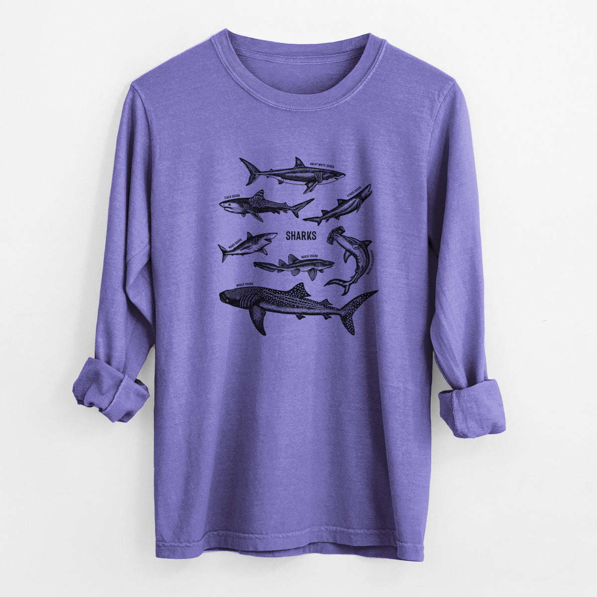 Violet purple Comfort Colors long sleeve shirt laid flat with the cuffs rolled, printed with a chart of black ink shark illustrations, including a whale shark, hammerhead and great white.