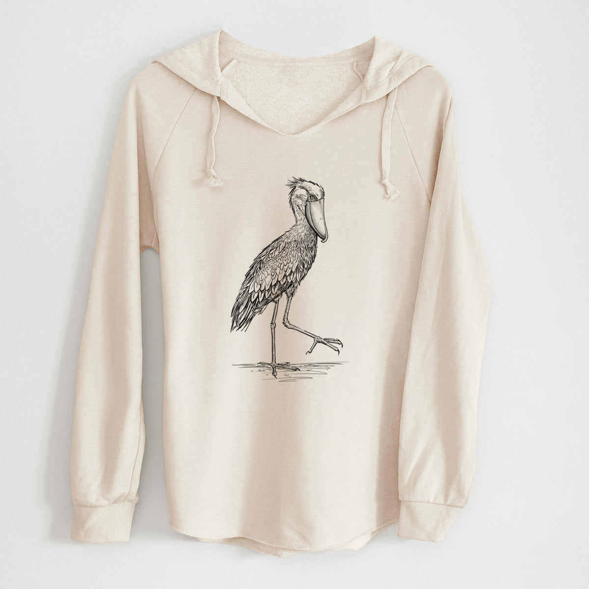 Bone cream women's Cali Wave hooded sweatshirt laid flat, printed with a black ink illustration of a shoebill stork standing on one leg.