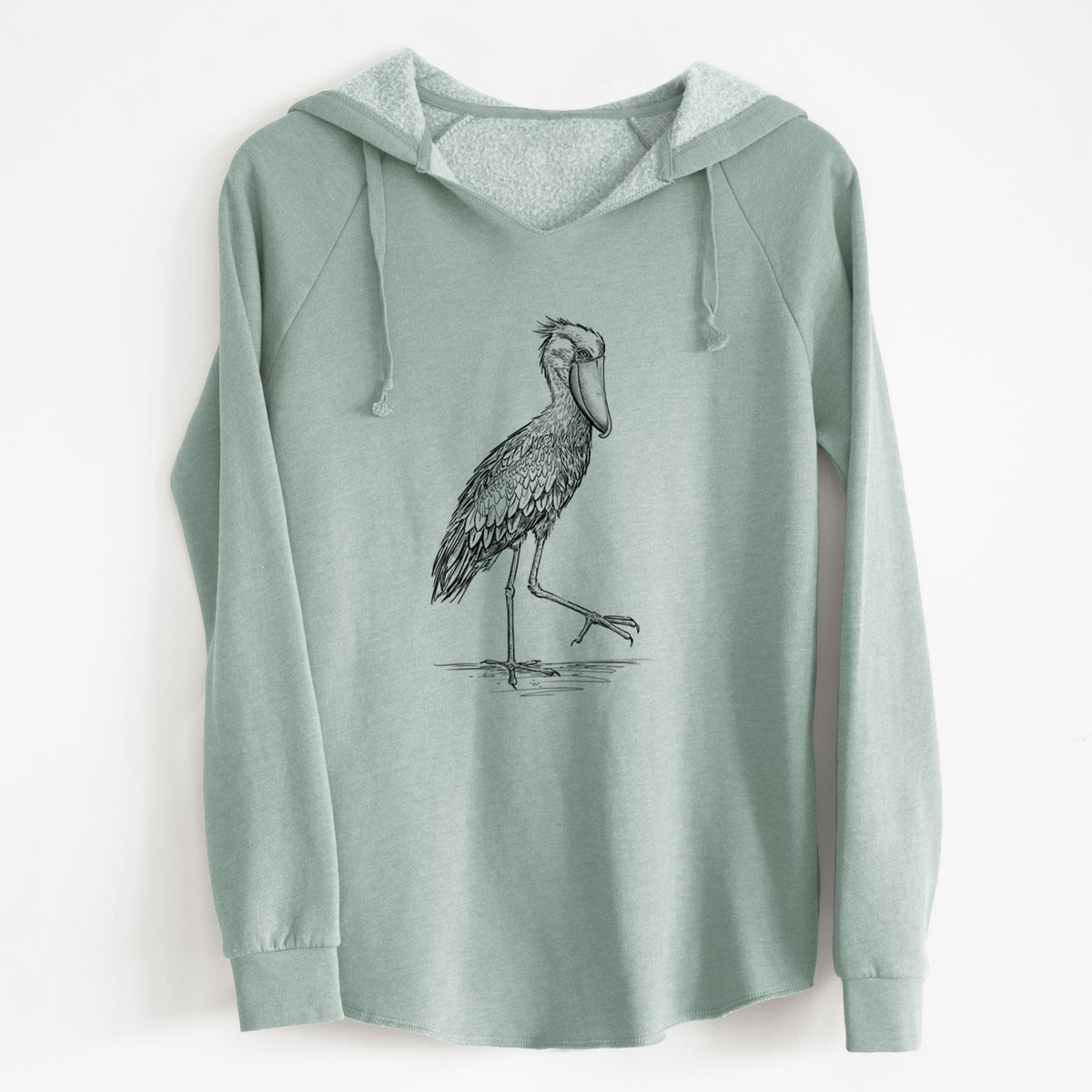 Sage green women's Cali Wave hooded sweatshirt laid flat, printed with a black ink illustration of a shoebill stork standing on one leg.