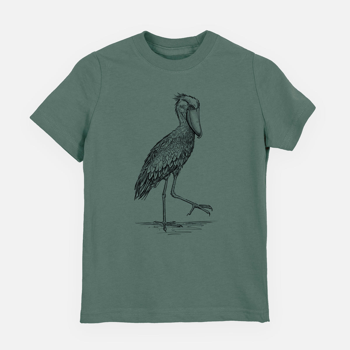 Basil green youth t-shirt laid flat, printed with a black ink illustration of a shoebill stork standing on one leg.