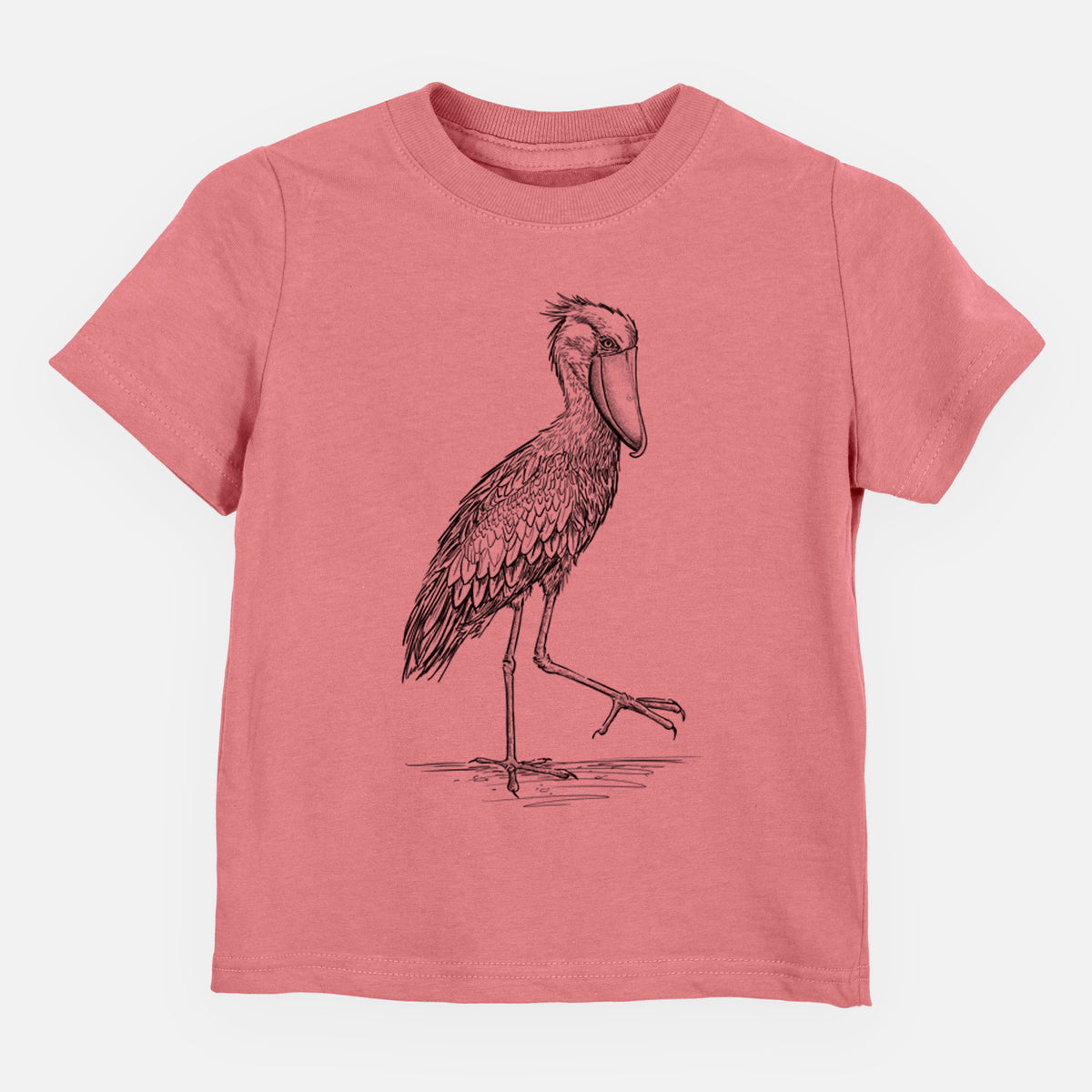 Mauve pink toddler t-shirt laid flat, printed with a black ink illustration of a shoebill stork standing on one leg.