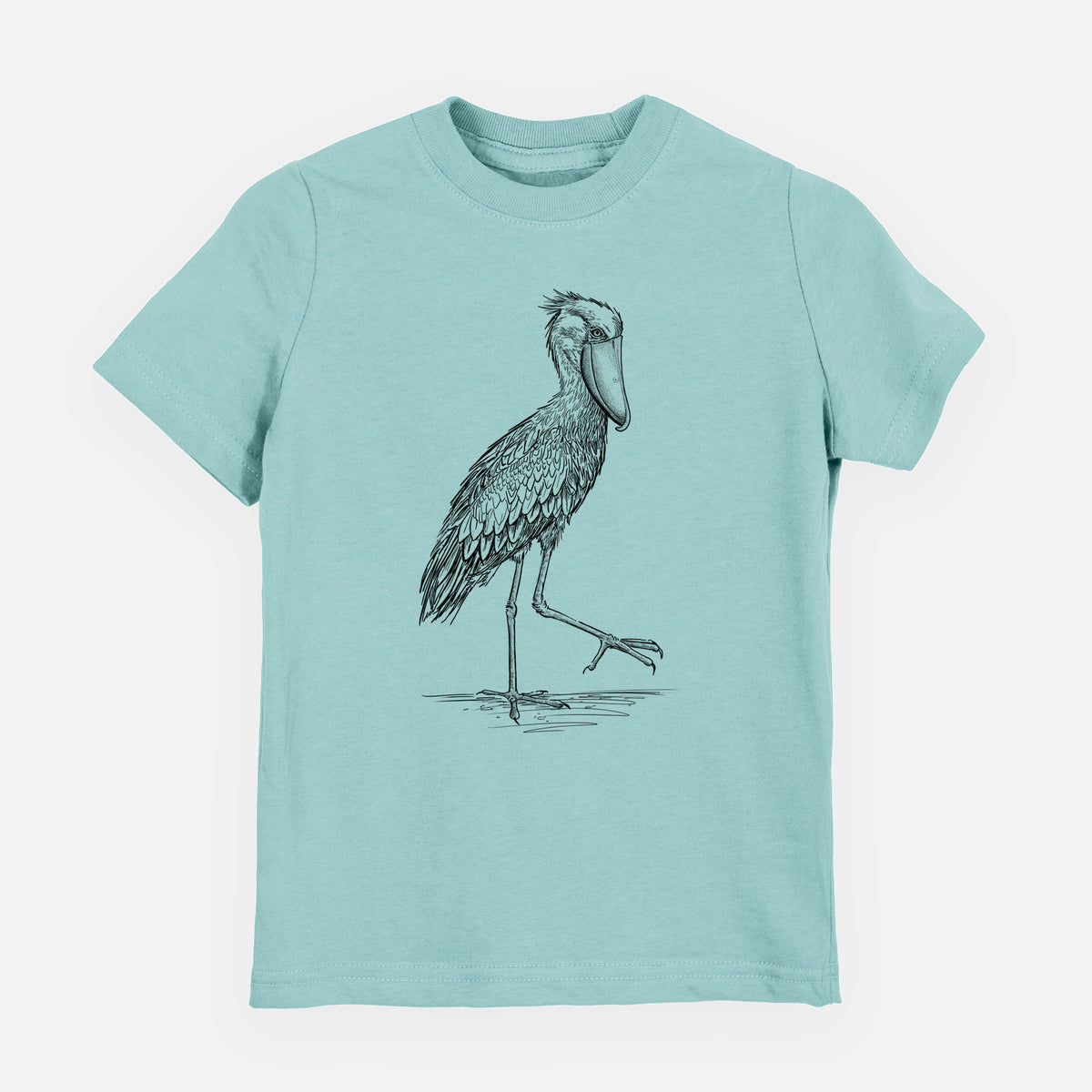 Saltwater youth t-shirt laid flat, printed with a black ink illustration of a shoebill stork standing on one leg.