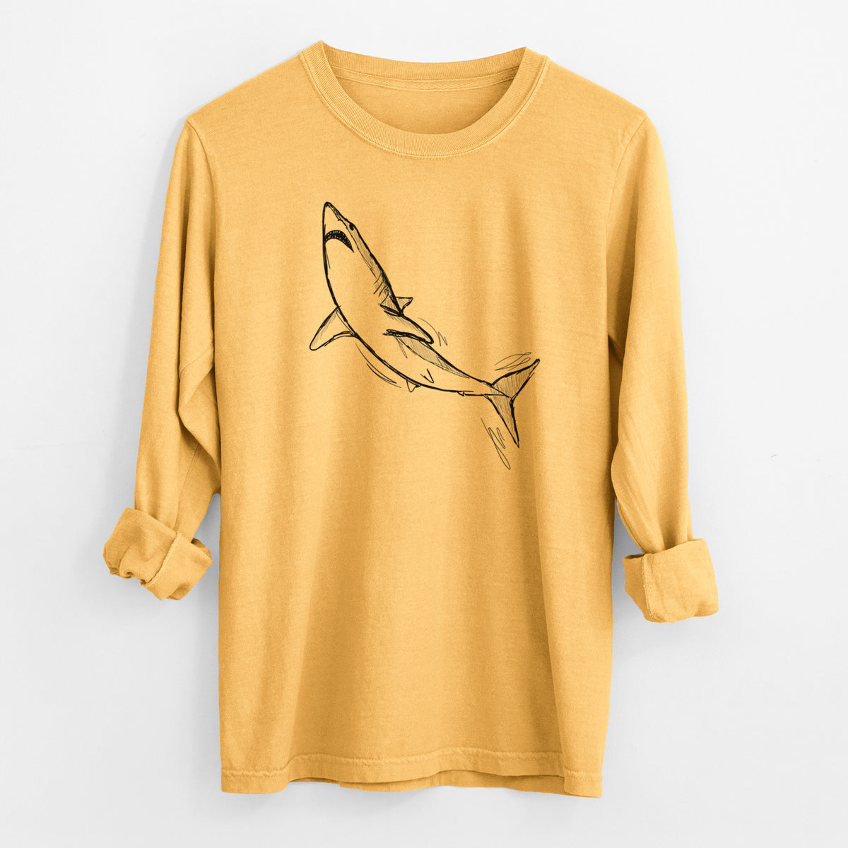 Golden wheat yellow Comfort Colors long sleeve shirt laid flat with the cuffs rolled, printed with a black ink illustration of a shortfin mako shark diving.