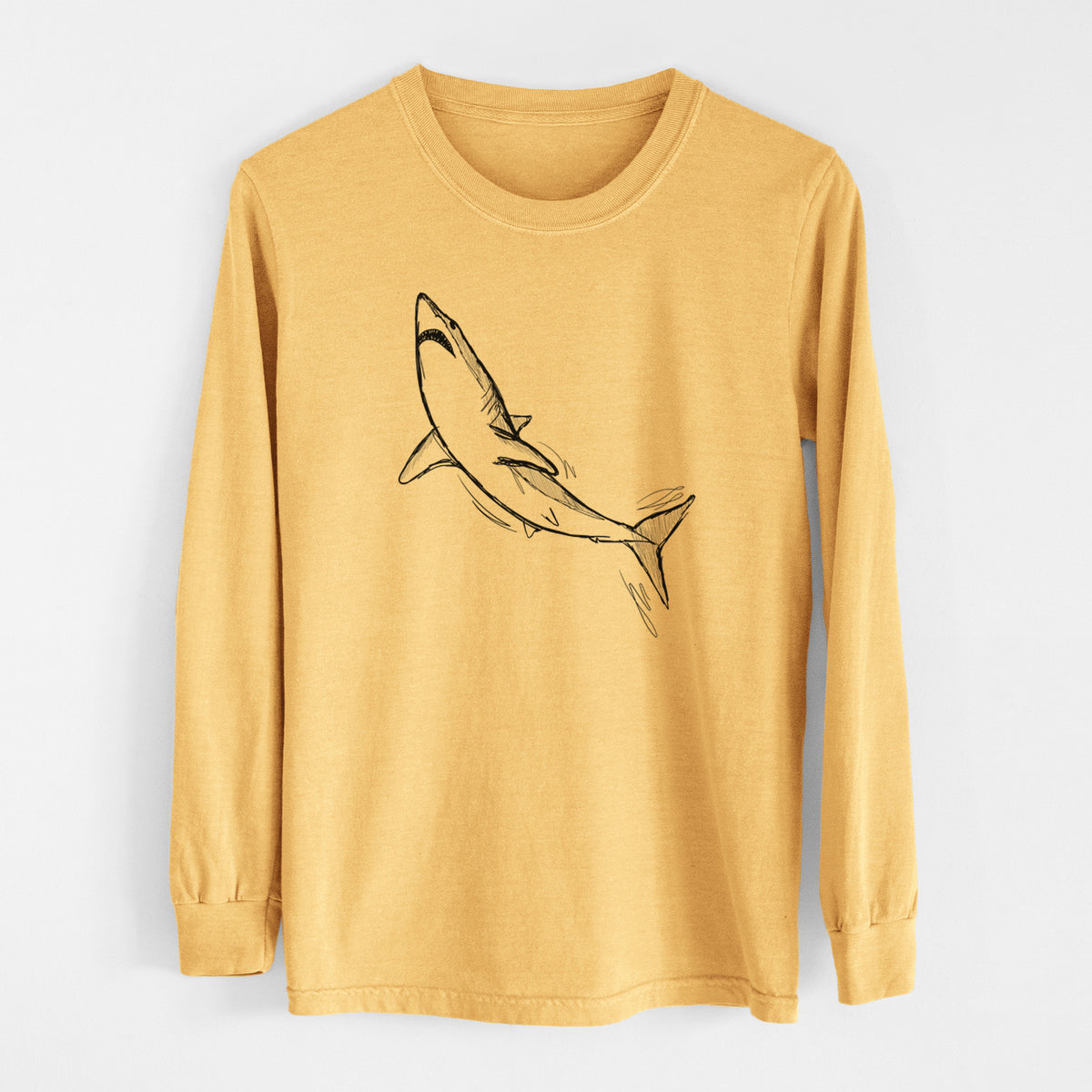 Golden wheat yellow Comfort Colors long sleeve shirt laid flat, printed with a black ink illustration of a shortfin mako shark diving.