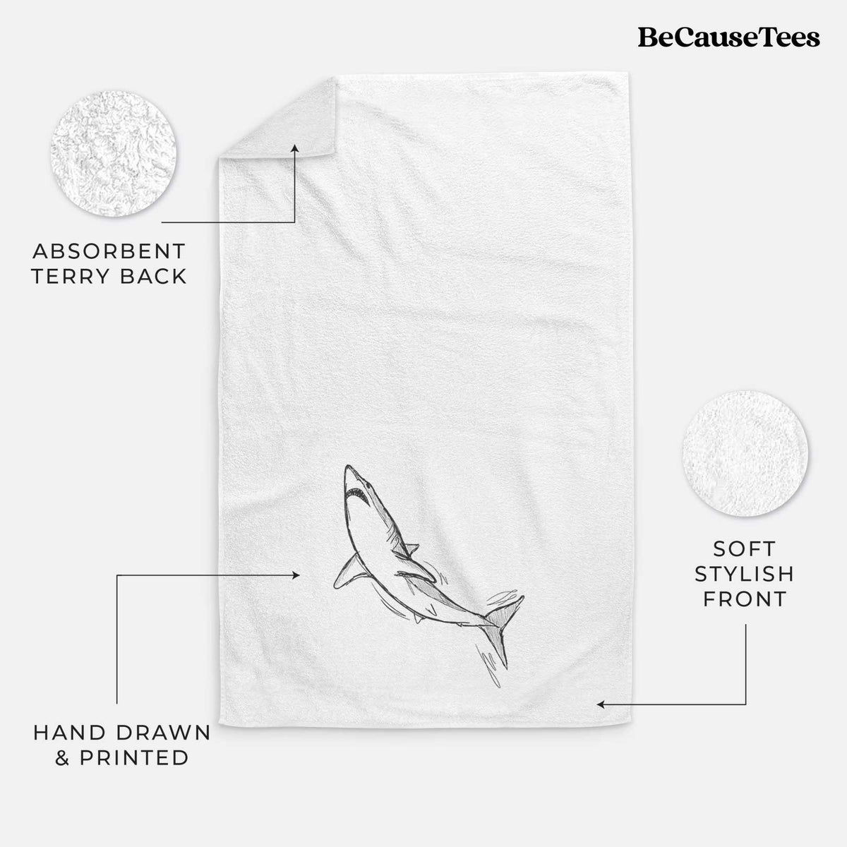 White hand towel printed with a black ink illustration of a shortfin mako shark diving.