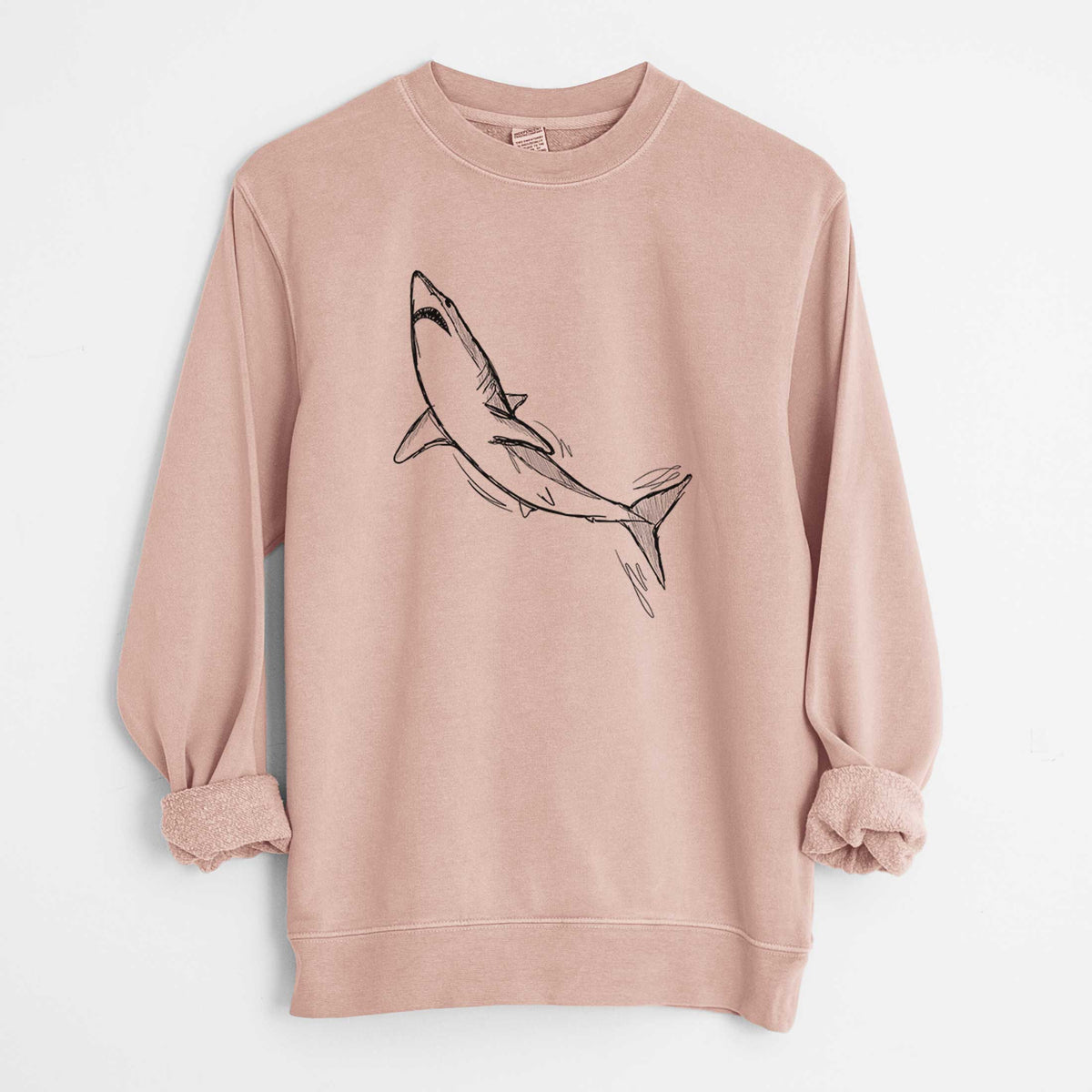 Dusty pink pigment dyed crewneck sweatshirt laid flat with the sleeves rolled, printed with a black ink illustration of a shortfin mako shark diving.