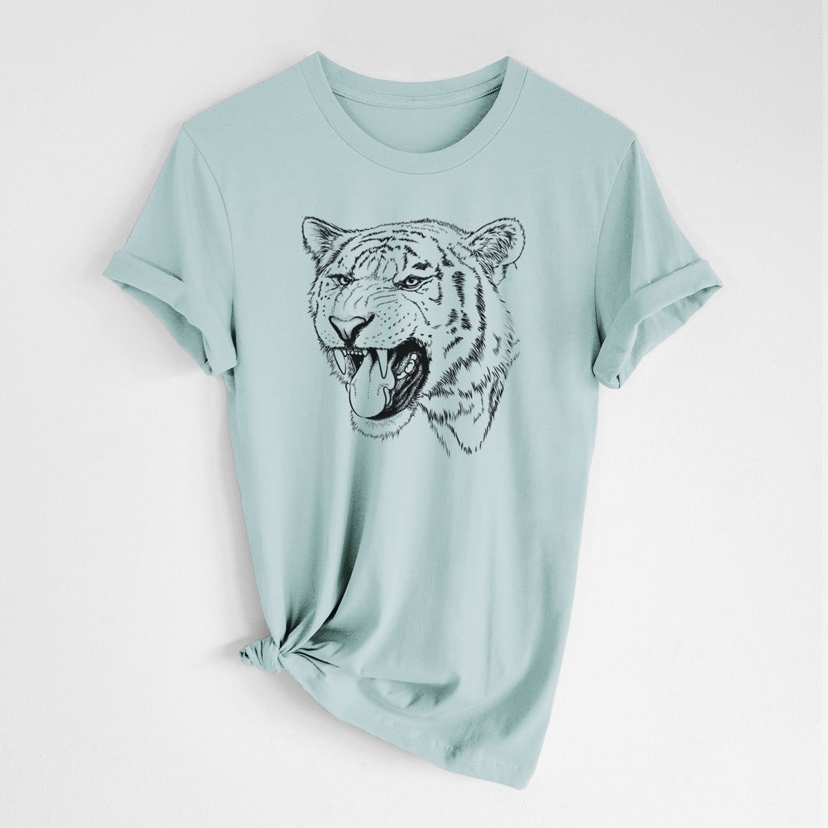 Dusty blue lightweight cotton t-shirt laid flat with the sleeves rolled, printed with a detailed black ink portrait of a roaring Siberian tiger.