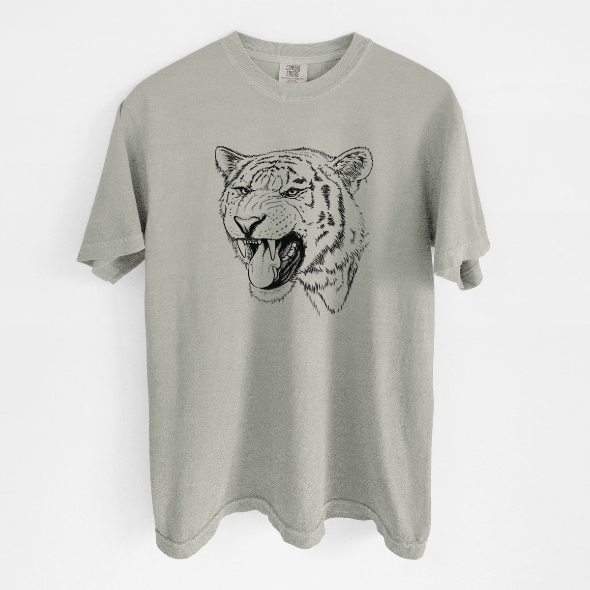 Sandstone beige Comfort Colors t-shirt laid flat, printed with a detailed black ink portrait of a roaring Siberian tiger.