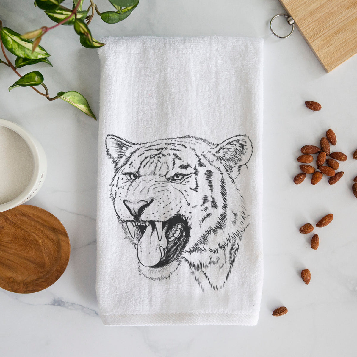 White hand towel printed with a detailed black ink portrait of a roaring Siberian tiger.