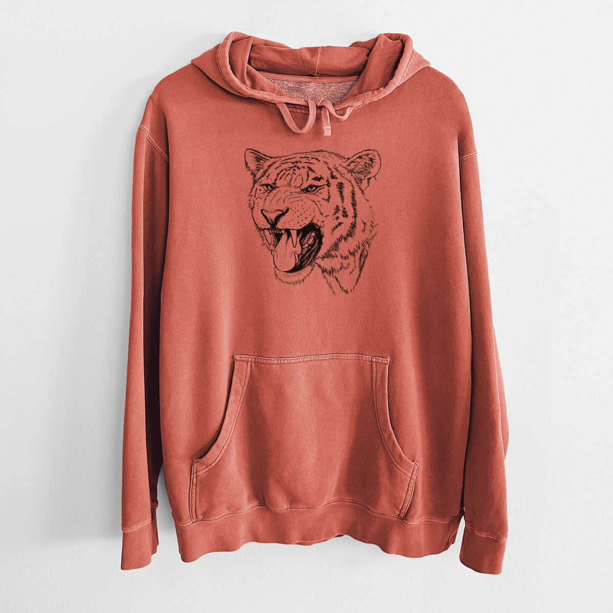 Amber orange pigment dyed hoodie laid flat, printed with a detailed black ink portrait of a roaring Siberian tiger.