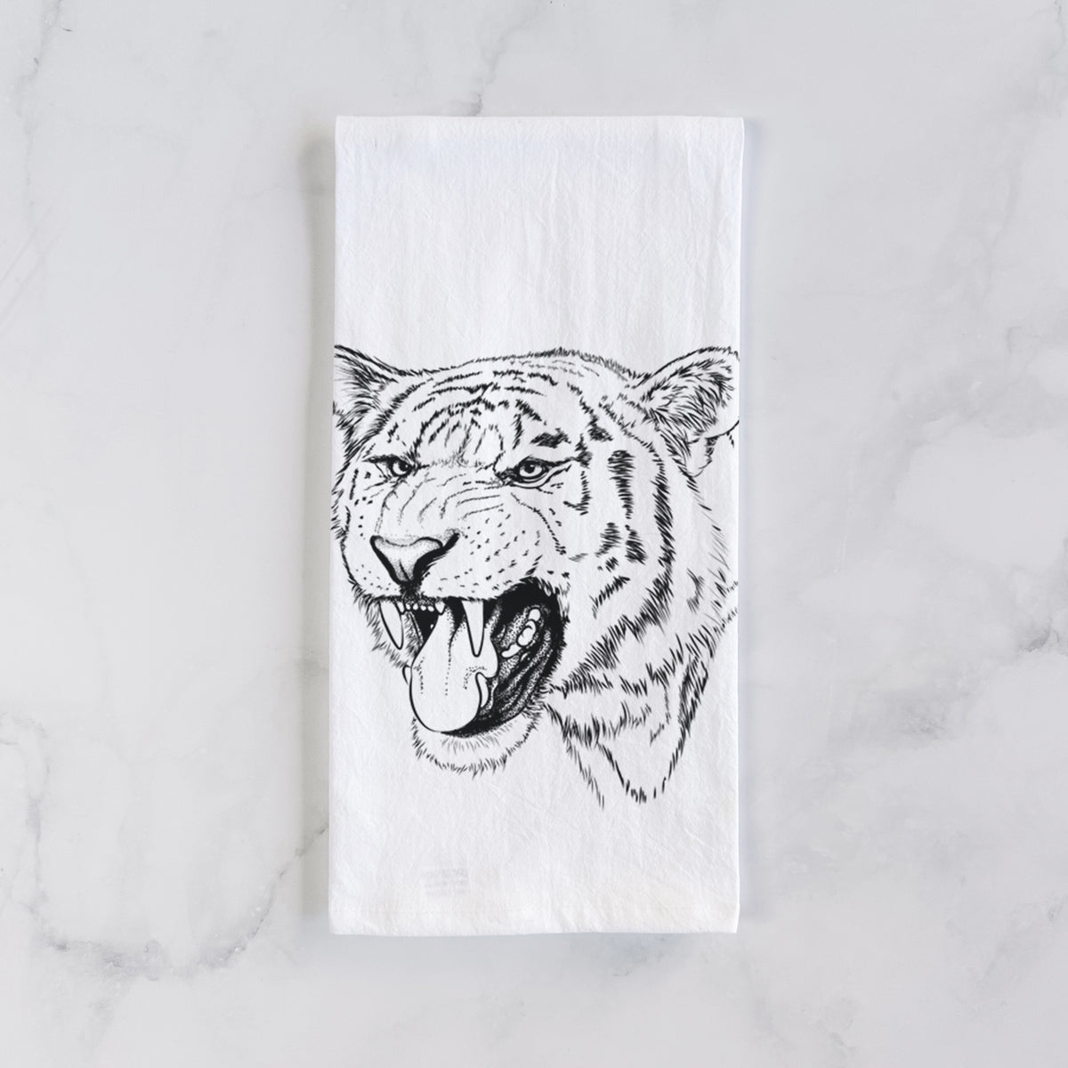 White cotton tea towel laid flat on marble, printed with a detailed black ink portrait of a roaring Siberian tiger.