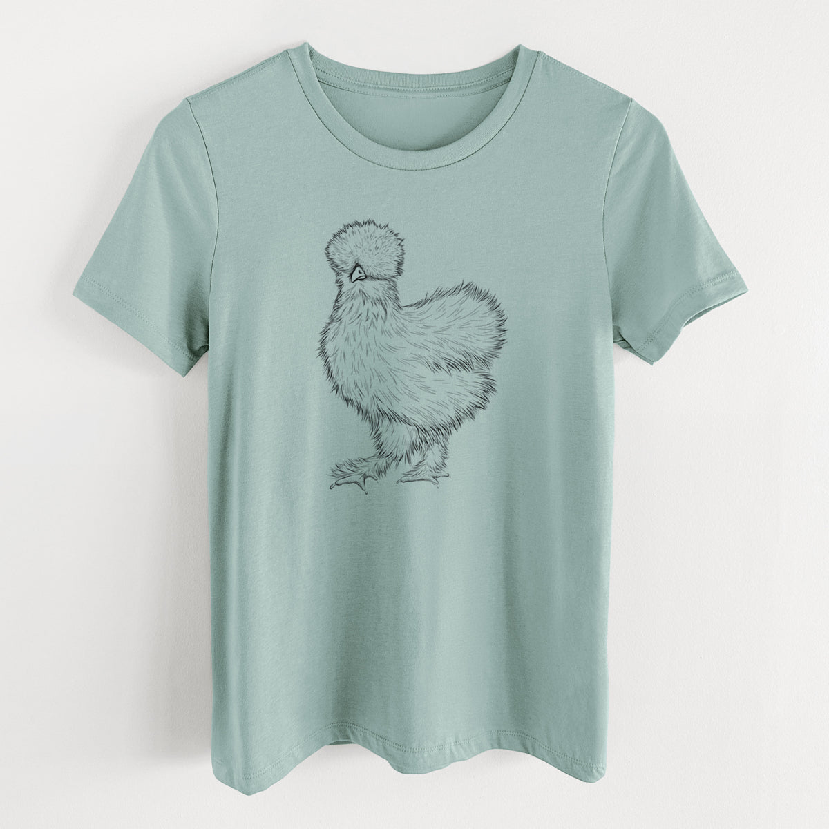 Dusty blue women's relaxed fit cotton t-shirt laid flat, printed with a black ink illustration of a fluffy silkie chicken.