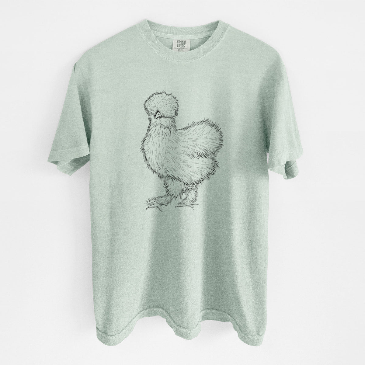 Bay green Comfort Colors t-shirt laid flat, printed with a black ink illustration of a fluffy silkie chicken.