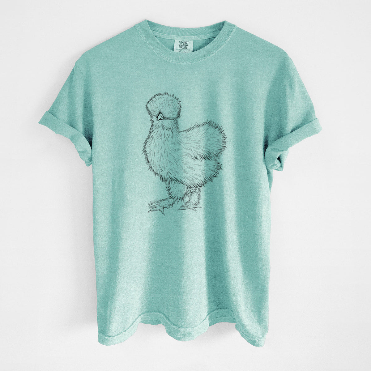 Chalky mint Comfort Colors t-shirt laid flat, printed with a black ink illustration of a fluffy silkie chicken.