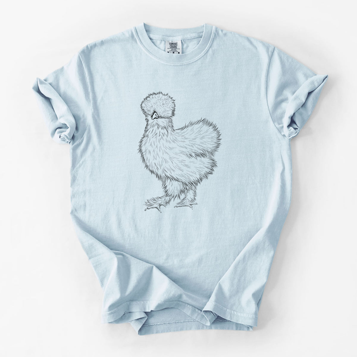 Chambray blue Comfort Colors t-shirt laid flat, printed with a black ink illustration of a fluffy silkie chicken.