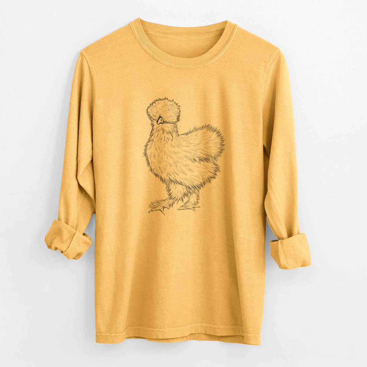 Golden wheat yellow Comfort Colors long sleeve shirt laid flat with the cuffs rolled, printed with a black ink illustration of a fluffy silkie chicken.