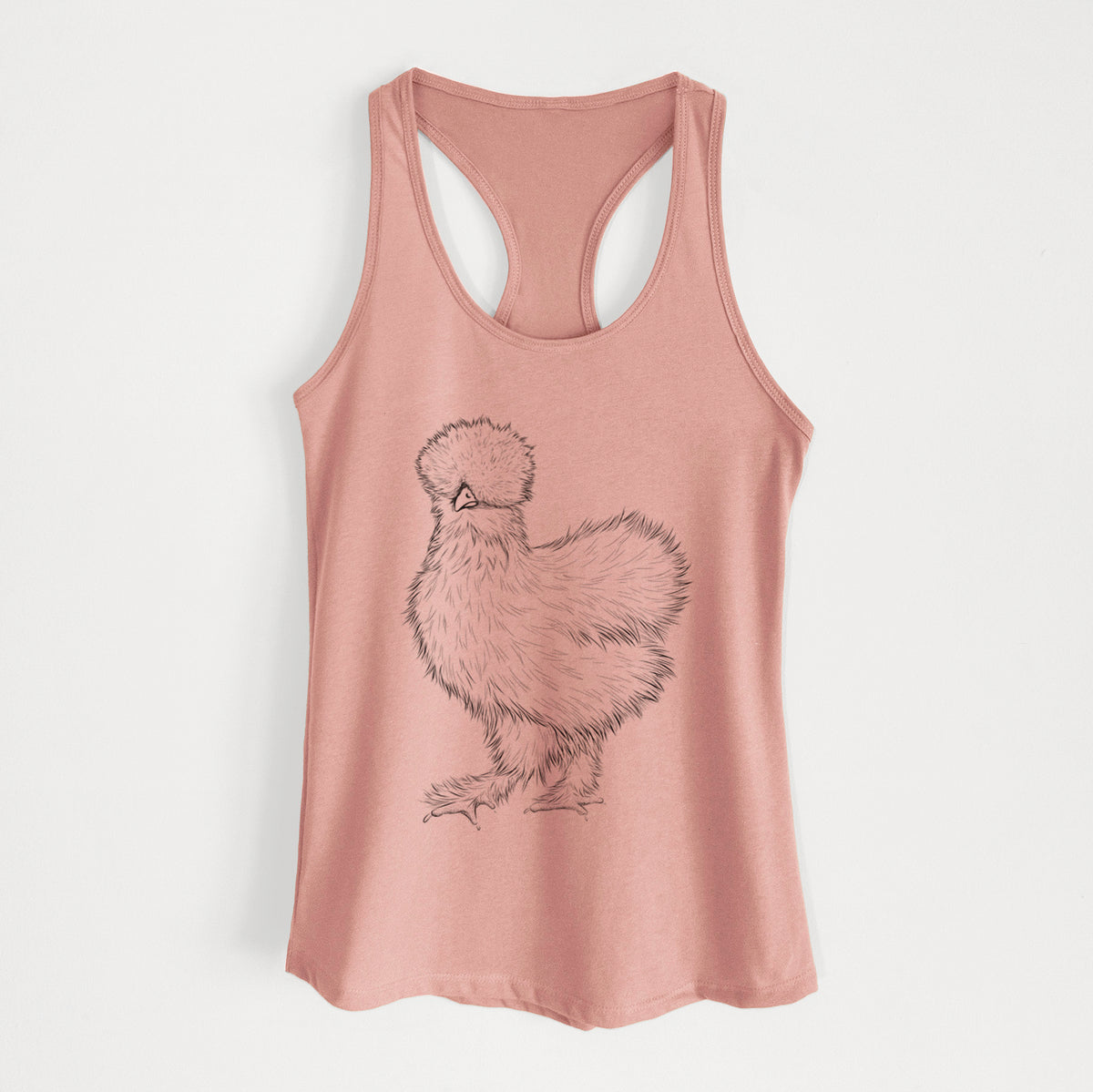 Desert pink women's racerback tank top laid flat, printed with a black ink illustration of a fluffy silkie chicken.