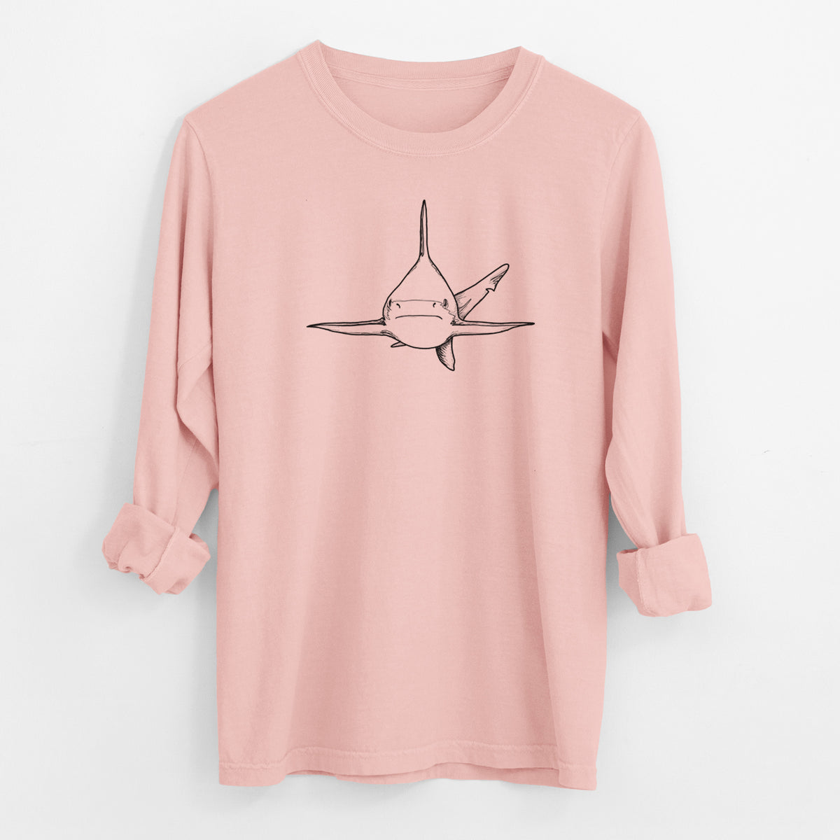 Peachy Comfort Colors long sleeve shirt laid flat with the cuffs rolled, printed with a black ink illustration of a silvertip shark swimming head-on.